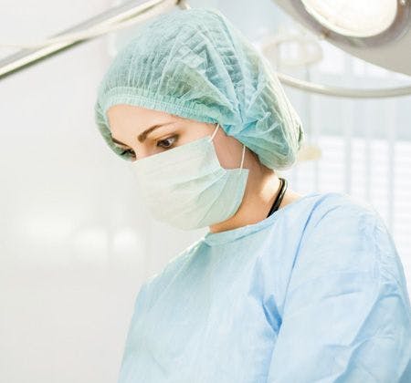 veterinary-young-female-surgeon-in-surgical-clothes-450px-shutterstock-140316592.jpg