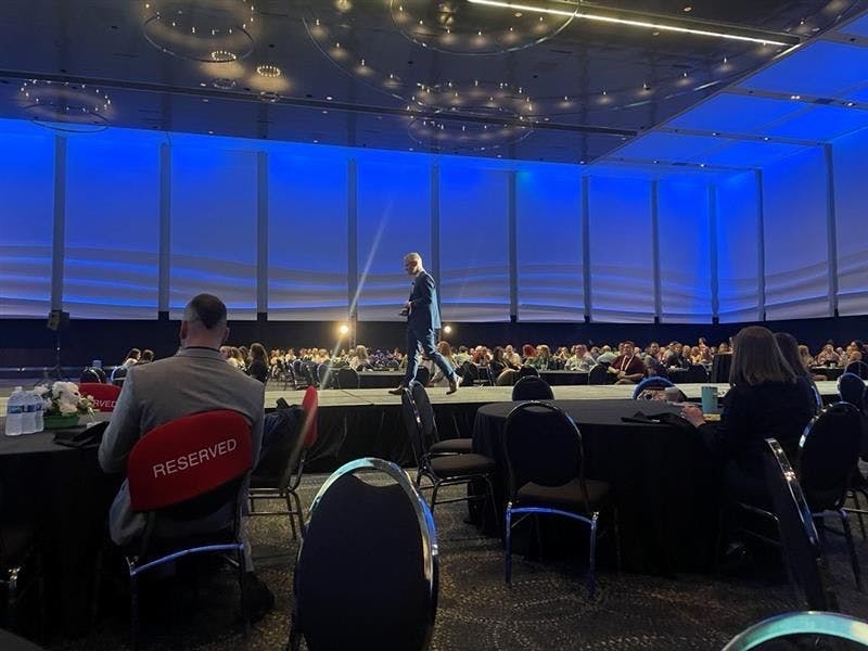 Speaker Dave Nicol, BVMS, Cert Mgmt, MRCVS, walks the runway during his keynote lecture at the 2023 Fetch dvm360 conference in Kansas City, Missouri.