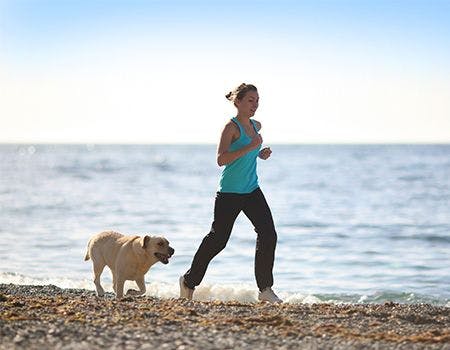 veterinary_woman running with dog_main.jpg