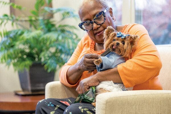 PetSmart Charities teams up with organizations such as Meals on Wheels America through grants that help local programs donate pet food to families like Joyce and her rescue dog Mystie (Photo courtesy of PetSmart Charities)