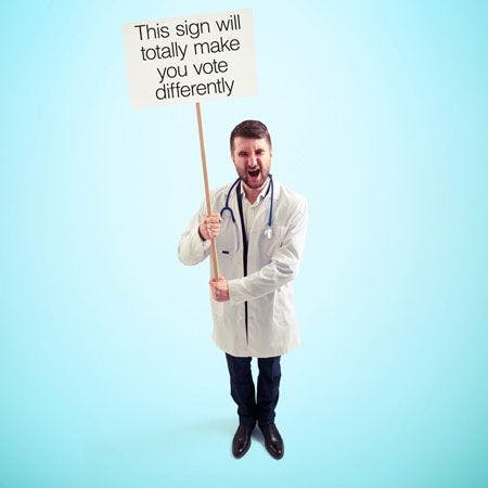 veterinary-view-from-above-of-discontented-screaming-doctor-with-empty-white-placards-450px-279503405.jpg