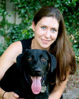 Dr. Kristin Welch with black lab