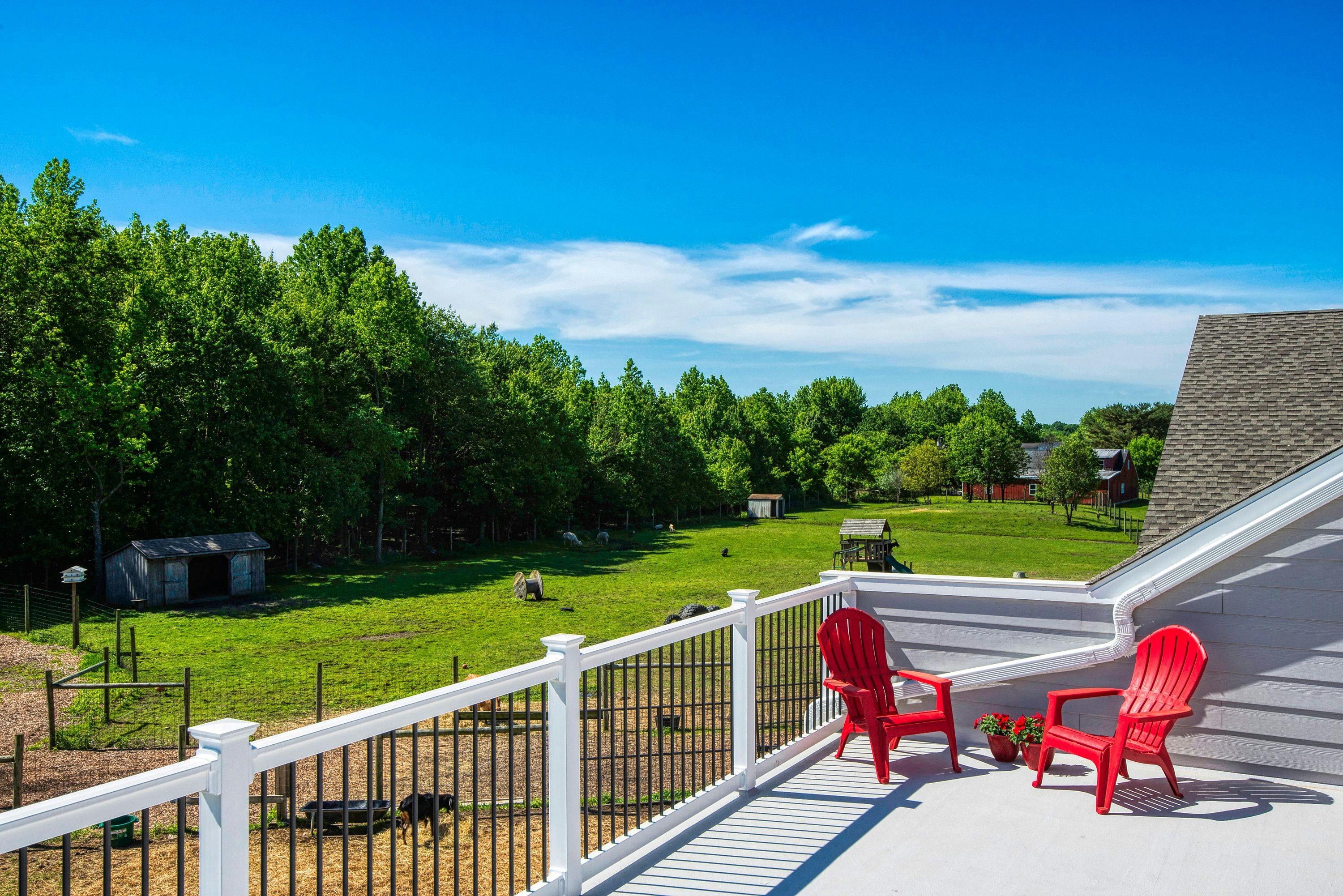 The auditorium and employee lounge open to a large outdoor fiberglass deck, complete with lounge chairs and surround sound, that overlooks the property’s 16 acres of farmland and a serene pond.