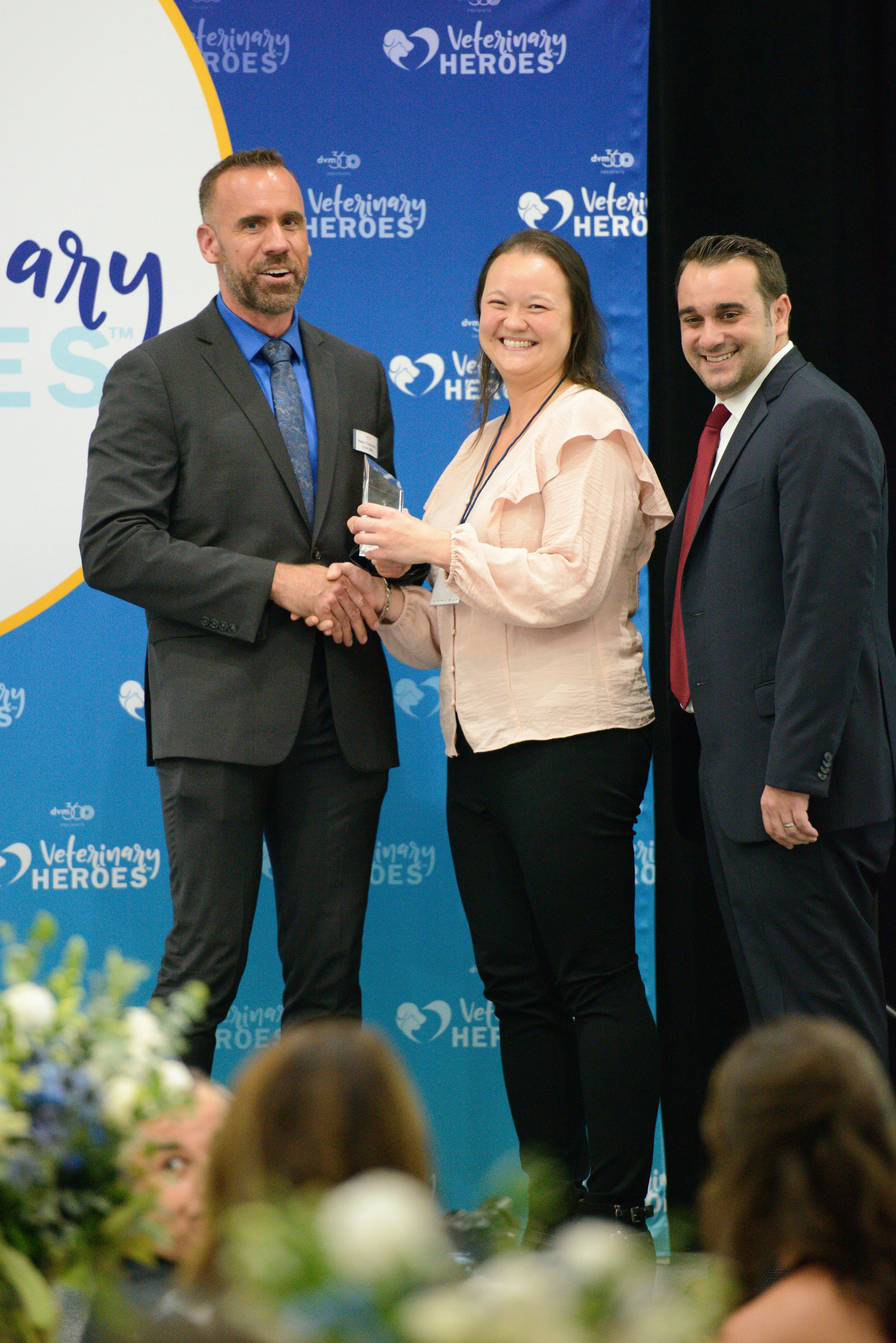 Photo: Jeeheon Cho Photography

Susie Martin (center) receives the Veterinary HeroesTM award for Client Service Representation from (left) Adam Christman, DVM, MBA, chief veterinary officer for dvm360®, and John Hydrusko, vice president, MultiMedia Animal Care LLC at MJH Life SciencesTM.  