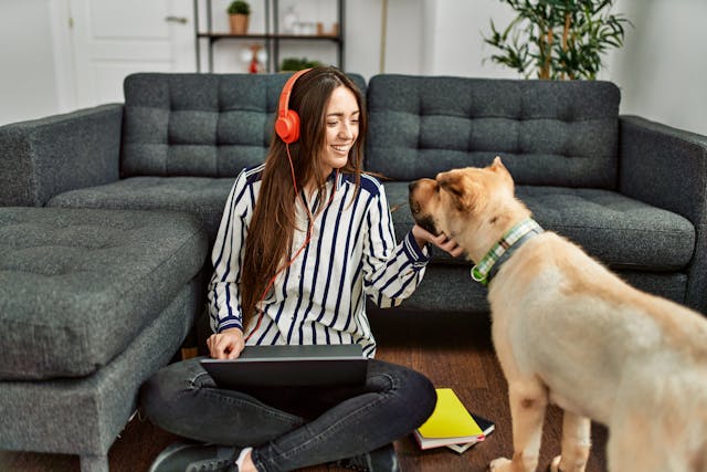Pet owner listening with her dog
