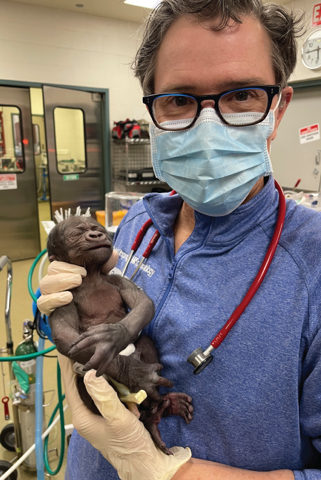 Robert Ursprung, MD, Neonatologist and National Director of Quality and Safety for Neonatology, holding Jameela. 