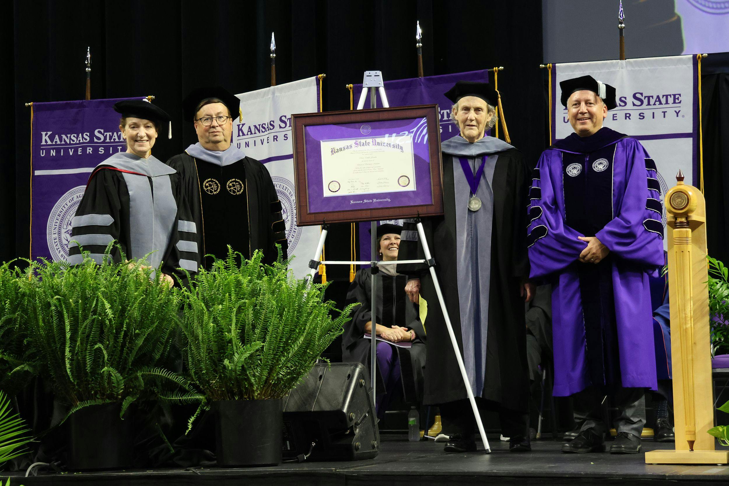From left: Bonnie Rush, Hodes family dean; James Roush, associate dean for academic programs and student success; Grandin; and Richard Linton, K-State president (Image courtesy of Kansas State University College of Veterinary Medicine) 