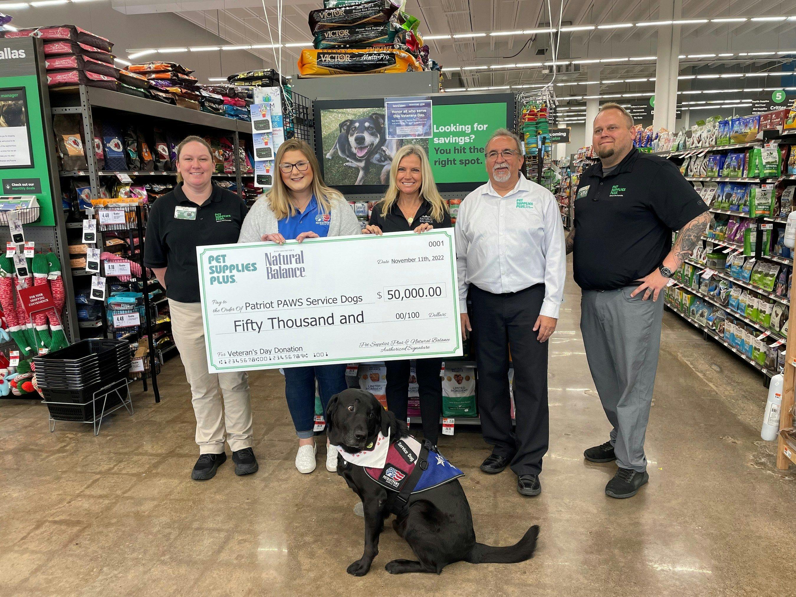 Pet Supplies Plus and Natural Balance presenting the $50,000 donation to Patriot PAWS  (Image courtesy of Pet Supplies Plus) 