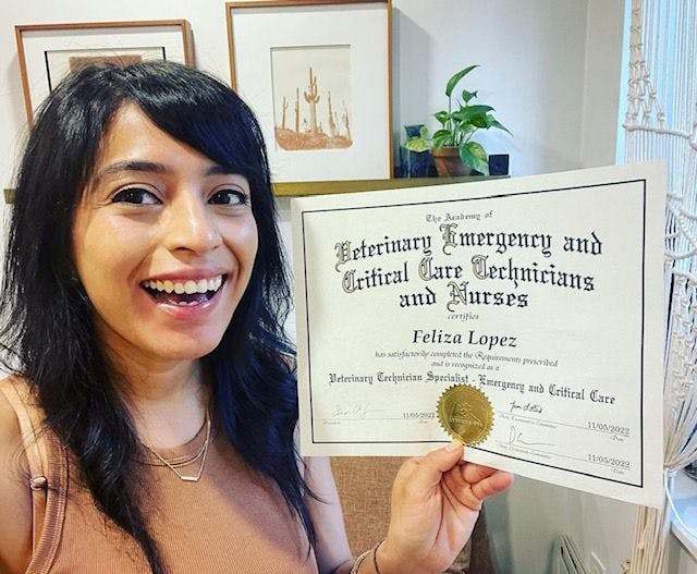 Lopez with her official veterinary technician specialist certificate.